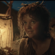 Hobbit in Rings of Power with a lantern in the background
